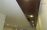 Двухуровневый натяжной потолок в гостиной